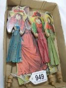 A quantity of Edwardian wooden figure with crepe dresses.