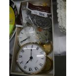 A tray of clock parts, lids etc.,