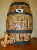 A vintage pottery Taunton cider barrel with wooden tap, 27 cm tall.