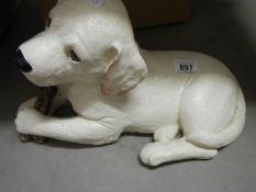 A Labrador puppy garden ornament.