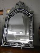 A Venetian style bevel edged and engraved mirror. COLLECT ONLY.