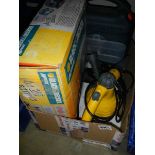 A boxed Black and Decker 'Mouse' sander and a steam cleaner