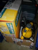 A boxed Black and Decker 'Mouse' sander and a steam cleaner