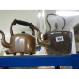 A Victorian copper kettle and one other.