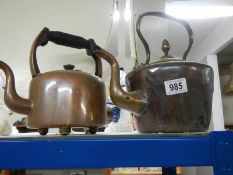 A Victorian copper kettle and one other.