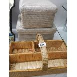 A vintage wicker cutlery basket and two lidded wicker boxes.