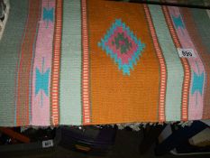 Three woven prayer mats.