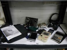 A vintage Nintendo game boy (no battery cover) a Casio scientific calculator, portable DVD player
