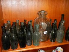 A good lot of vintage bottles including a demi-john.