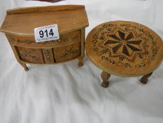 A miniature inlaid sideboard and table.