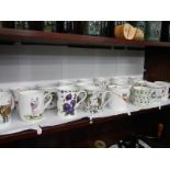 A quantity of decorative mugs.