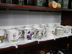 A quantity of decorative mugs.
