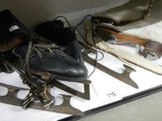 Two pairs of vintage ice skates.