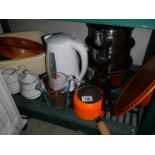 A Le Crueset milk pan and other kitchen items.