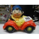 A vintage hand painted pottery Noddy in his car money box.