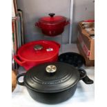 2 Le Creuset cast iron lidded pots and a Pyrex cast iron lidded pot and 1 other