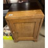 An Edwardian oak pot cupboard