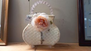 A decorative lamp styled as a ladies handbag IWO