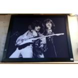 A large framed print of Mick Jagger and Bill Wyman 110cm x 87cm COLLECT ONLY