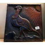 A large carved mahogany plaque of a bird 35cm x 37cm