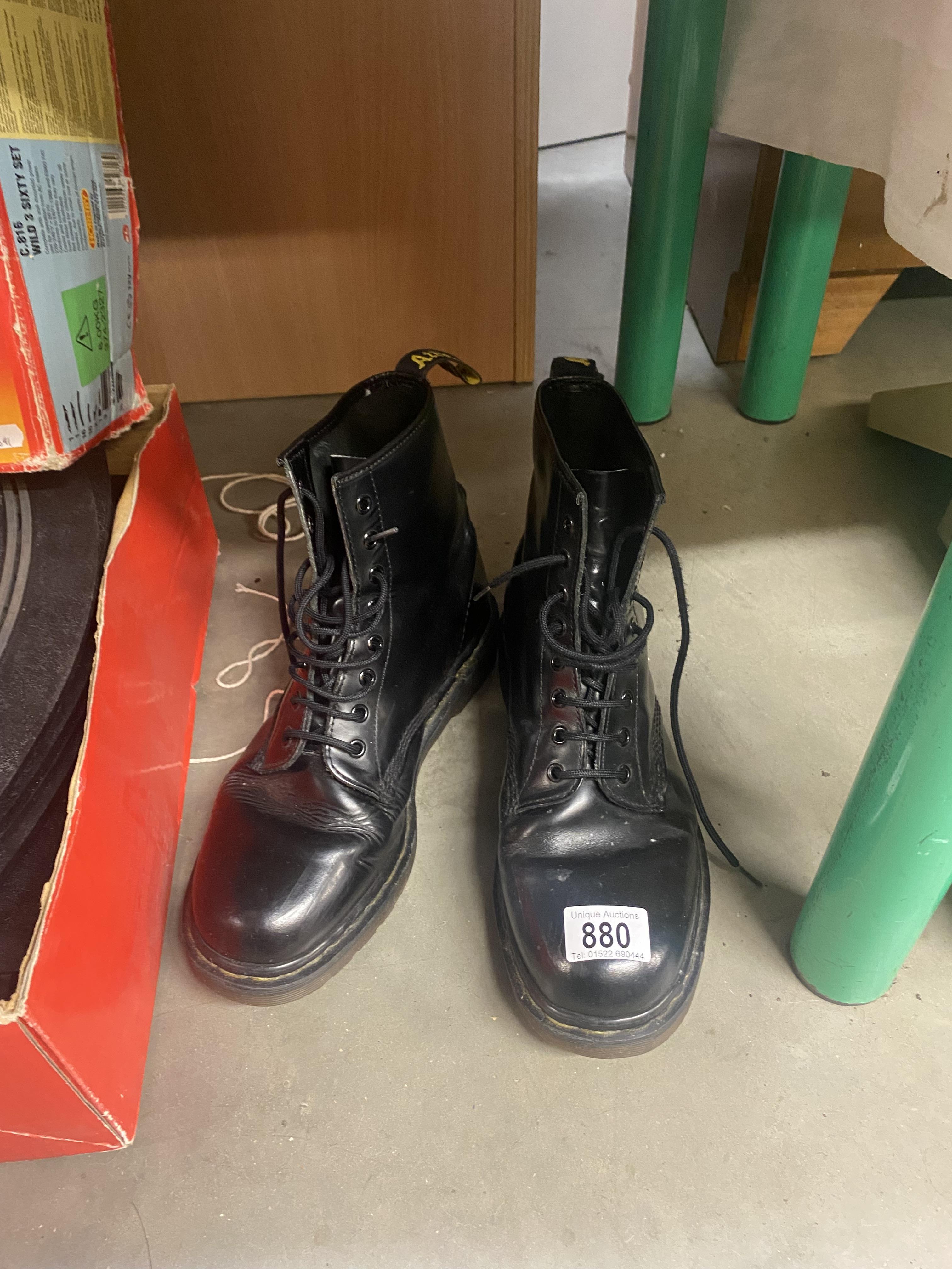 A pair of used 8 hole Dr Martin boots approximate size 9