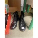 A pair of used 8 hole Dr Martin boots approximate size 9