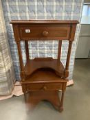 A pair of mahogany finished bedside tables