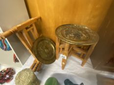 2 Indian folding tables with embossed brass plaque tops