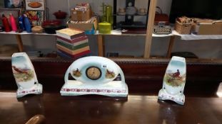 A 1930's pottery clock set decorated with flowers & pheasants A/F (movement incomplete)