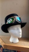 A steam punk hat with goggles