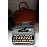 A vintage Royal Royalite typewriter with travel case