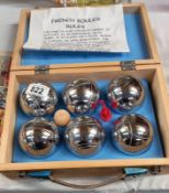 A wooden cased traditional French boule set