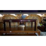 A dark wood stained coffee table with 2 glass panels, COLLECT ONLY