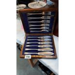 An oak cased silver plate set of fish knives and forks by Cross Bros Cardiff