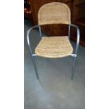 A metal framed chair with wicker seat & back panel, COLLECT ONLY