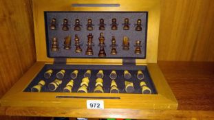 An inlaid folding chess board & chess pieces