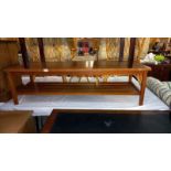 A 1970's teak coffee table with magazine shelf, 50cm x 143cm x 41cm, COLLECT ONLY