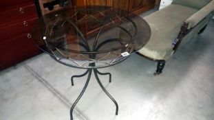 A wrought iron table with smoke glass top, Diameter 75cm x 76cm high, COLLECT ONLY
