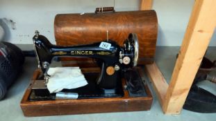 A cased vintage Singer sewing machine COLLECT ONLY