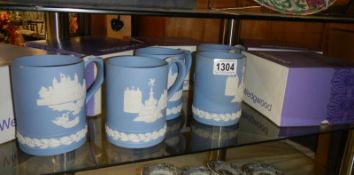 A quantity of Wedgwood tankards in boxes.