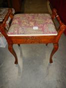 An Edwardian piano stool.