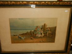 A framed and glazed print featuring children with dog on a beach.