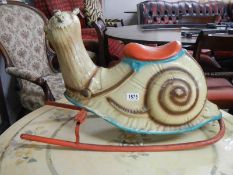 A 1950's Mobo pressed steel rocking snail, COLLECT ONLY.