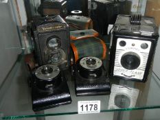 Four vintage camera's.