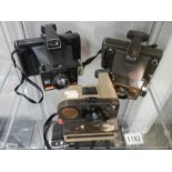 Three old Polaroid camera's.