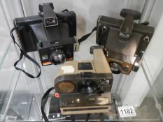 Three old Polaroid camera's.