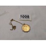 A 1907 Edward VII gold half sovereign in a 9ct gold mount on a 9ct gold chain, total weight 5.8 g