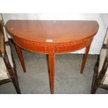 An early 20th century fold over mahogany card table,. COLLECT ONLY.