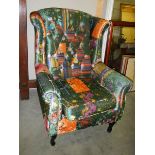 A wing armchair with multi coloured upholstery, COLLECT ONLY.