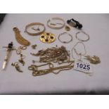 A mixed lot of yellow metal jewellery including bangles, earrings, chains etc.,